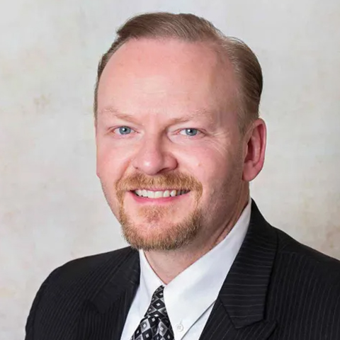 portrait picture of MICHAEL D. LAWRYNK smiling