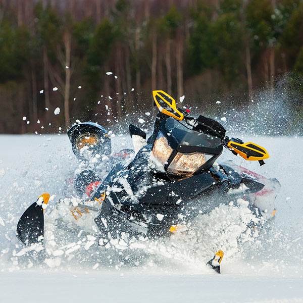 snowboarding at the top of a mountain