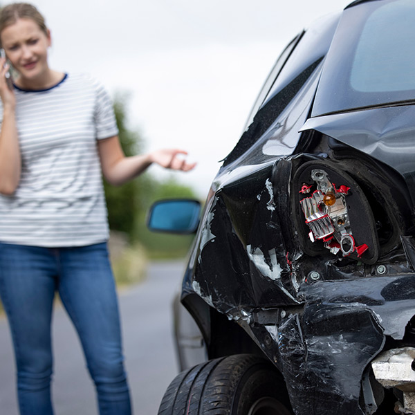woman talking on the phone about a car crash