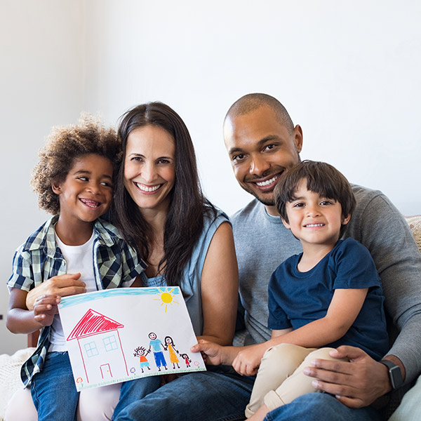 Family holding a family picture painting